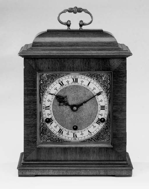 An English walnut-veneered reproduction quarter-chiming bracket clock, second half 20th century