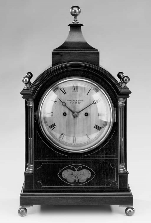 An Edwardian inlaid mahogany striking mantel clock, early 20th century
