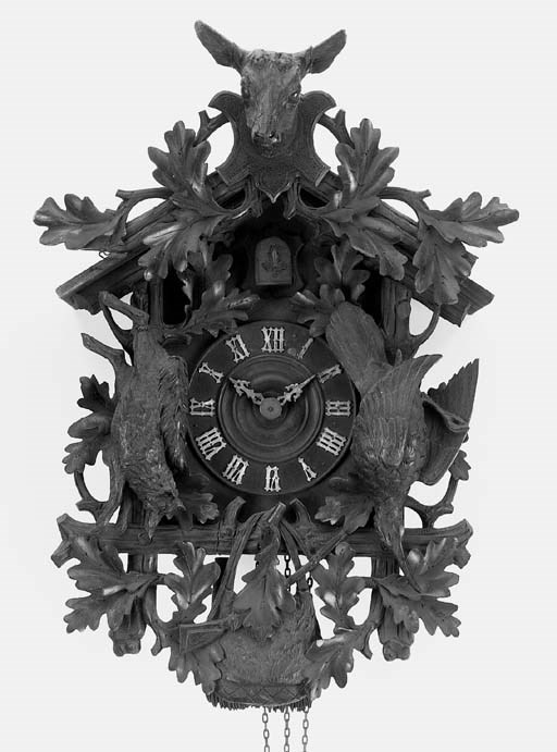 A Black Forest carved and stained wood cuckoo wall clock, early 20th century