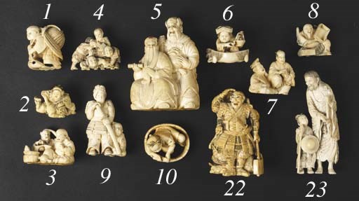 A stained ivory okimono of two warriors