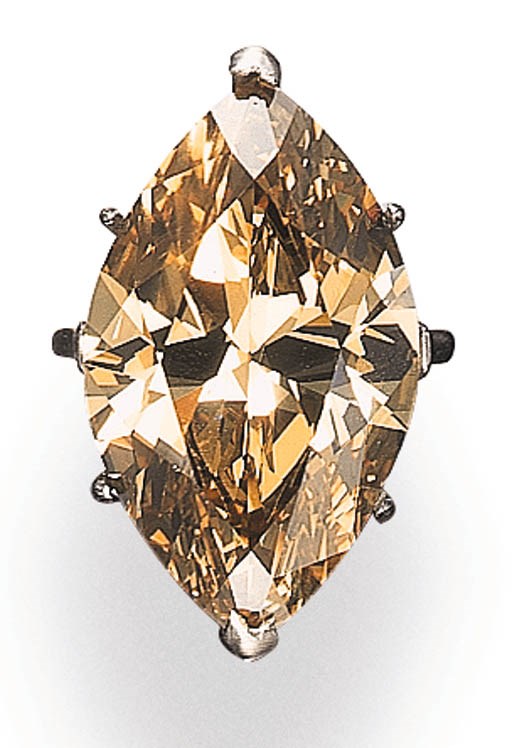 AN IMPRESSIVE SINGLE-STONE FANCY DEEP BROWN-YELLOW DIAMOND RING