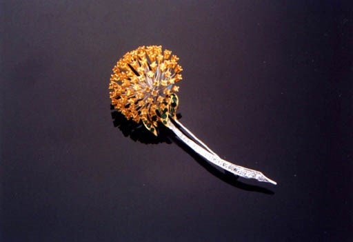 A YELLOW SAPPHIRE, EMERALD AND DIAMOND FLOWER BROOCH