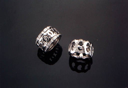 TWO DIAMOND AND 18K WHITE GOLD RINGS, BY CARTIER