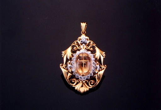 A RUTILATED QUARTZ AND DIAMOND PENDANT