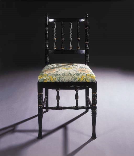 A set of four 'Morris and Co' ebonised side chairs