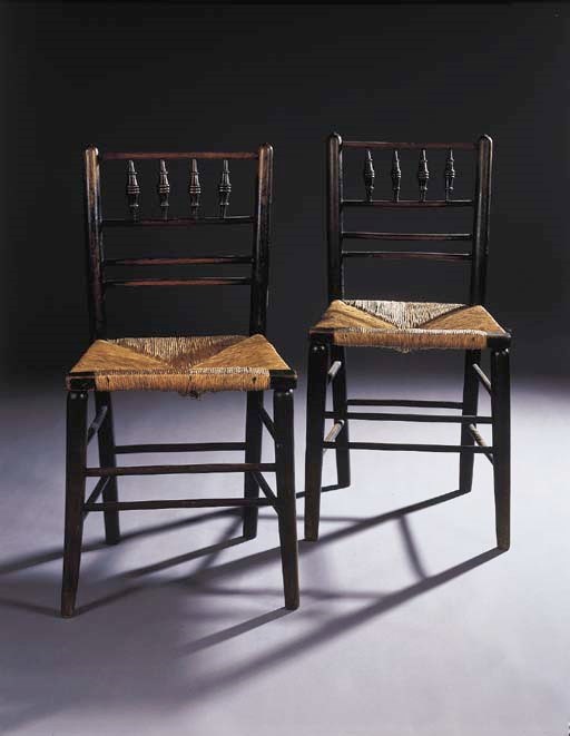 A pair of ebonised and parcel-gutt decorated side chairs