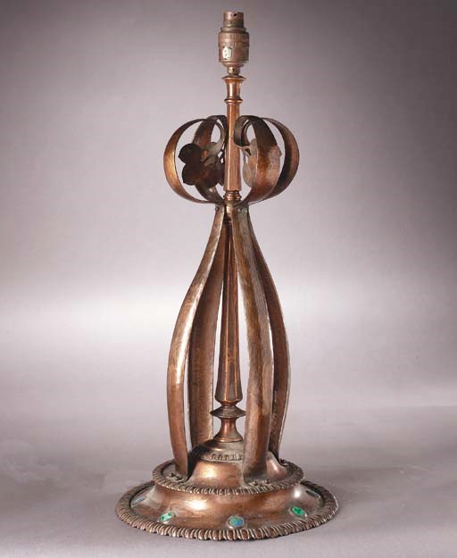 An Arts and Crafts copper and enamel lamp stand