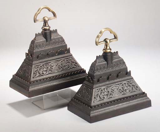 A pair of A Kemrick and Sons wrought iron and brass door stops