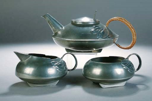 A Solkets pewter three piece tea set