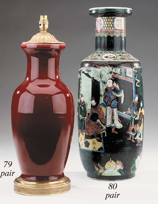A near pair of sang de boeuf glazed ceramic vases, gilt metal mounted as table lamps, of recent manufacture