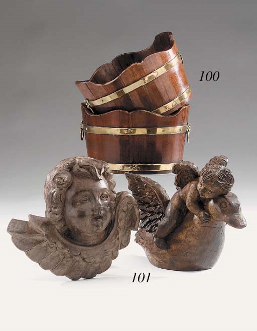 A Far Eastern carved and stained wood cherub, of recent manufacture