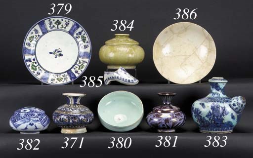 A Persian blue and white miniature pottery shoe