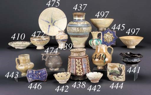 A Raqqa blue, black, iron-red and white pottery baluster vase