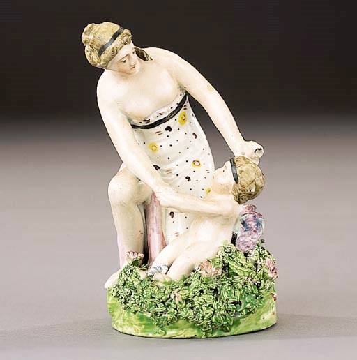 A pearlware group of Venus and Cupid
