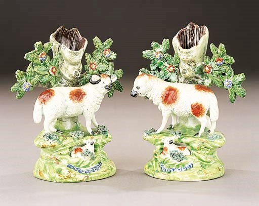 A pair of Walton spill vases of a ram and ewe with lambs