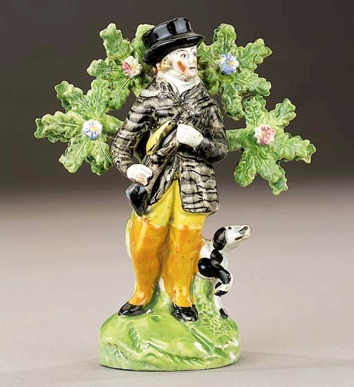 A pearlware figure of a sportsman