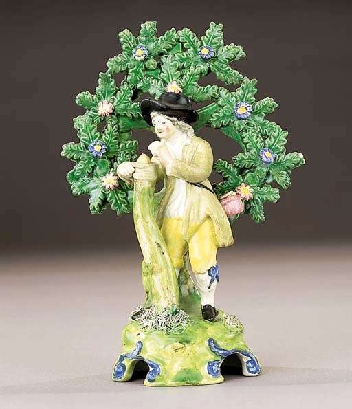 A pearlware figure of a gardener