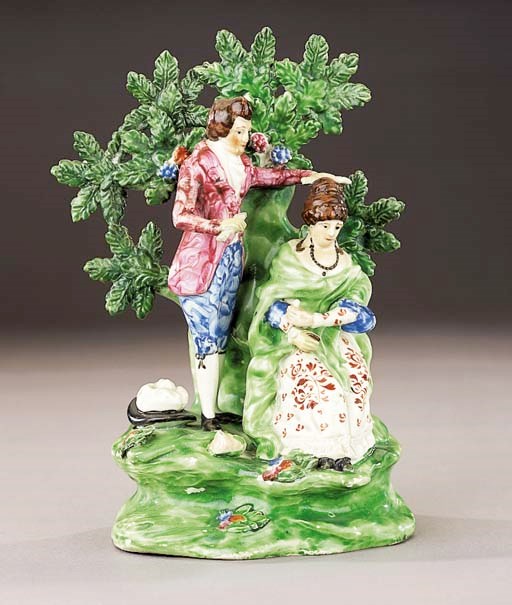 A pearlware group of a coiffeur