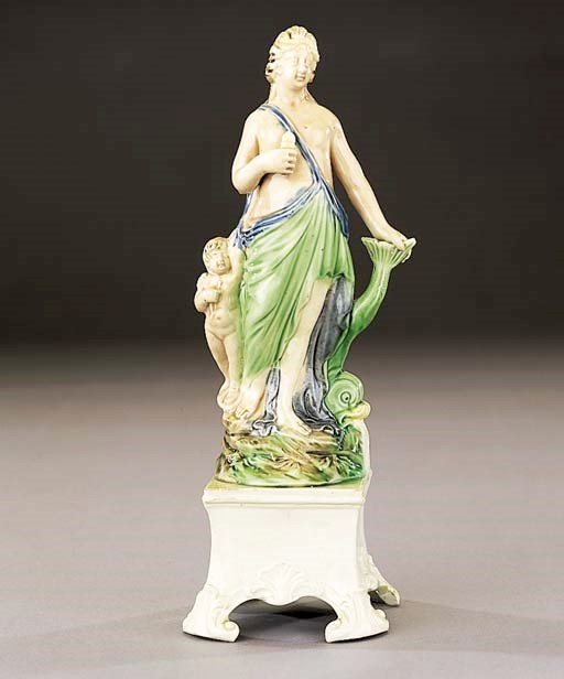 A pearlware group of Venus and Cupid