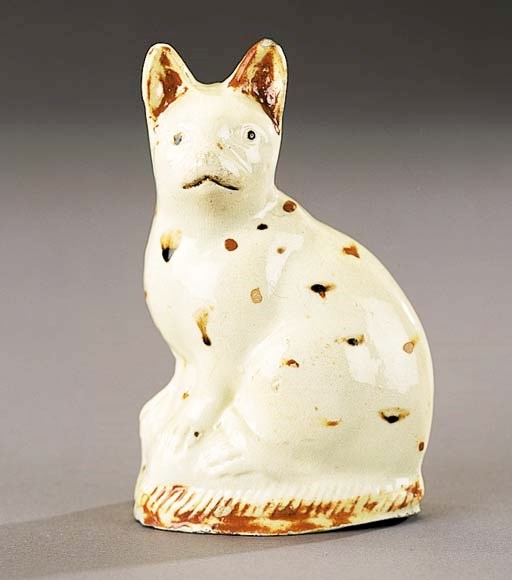 A creamware model of a cat