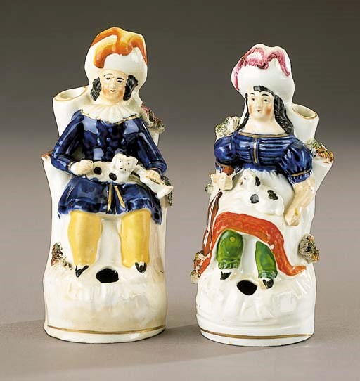 Two penholders of musicians seated with hounds
