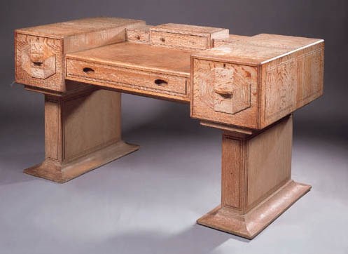 A LIMED OAK WRITING DESK