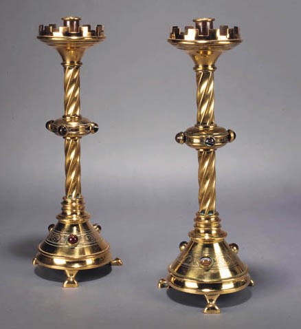 A PAIR OF GOTHIC BRASS CANDLESTICKS
CIRCA 1850