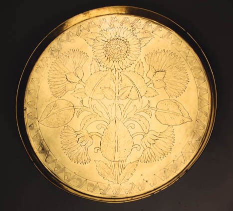 A BENHAM AND FROUD BRASS CHARGER
CIRCA 1880