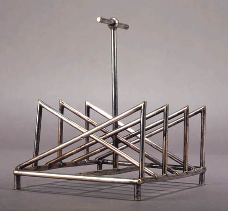 A RARE JAMES DIXON & SONS ELECTROPLATED TOASTRACK
DESIGNED BY DR. CHRISTOPHER DRESSER, 1880