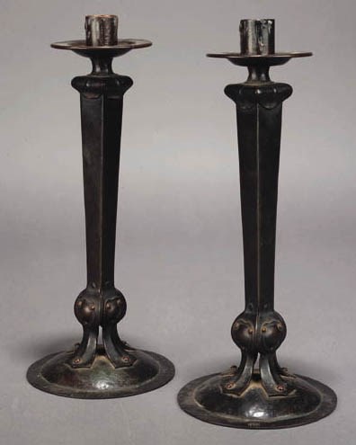 A PAIR OF COPPER CANDLESTICKS
CIRCA 1910