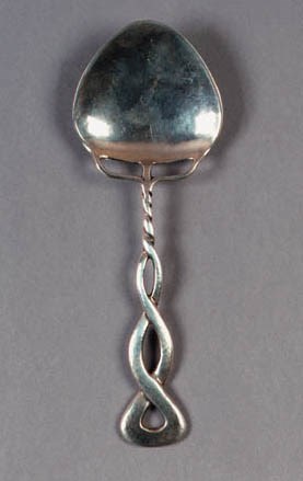 A LIBERTY & CO SILVER SPOON
DESIGNED BY OLIVER BAKER, BIRMINGHAM 1935
