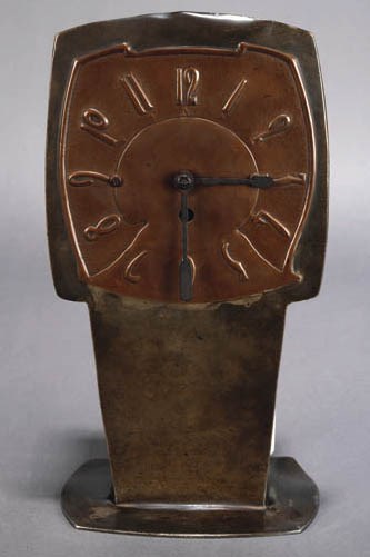 A LIBERTY TUDRIC PEWTER MANTLE CLOCK
DESIGNED BY ARCHIBALD KNOX, CIRCA 1902-1905