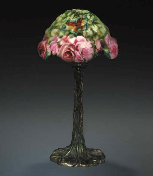 A REVERSE-PAINTED GLASS AND PATINATED-METAL BOUDOIR LAMP