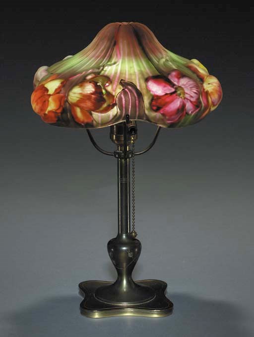 A REVERSE-PAINTED AND PATINATED-METAL GLASS BOUDOIR LAMP