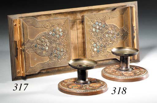 AN 'ABALONE' PATTERN GILT-BRONZE EXTENDABLE BOOKRACK
