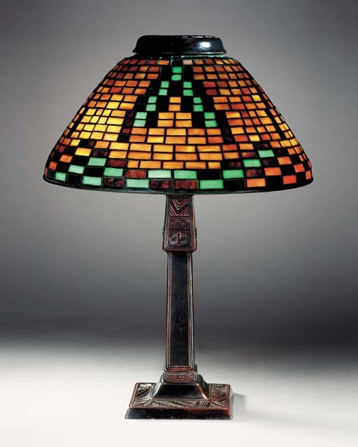 AN 'AMERICAN INDIAN' LEADED GLASS AND BRONZE DESK LAMP