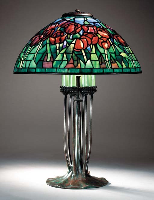 A 'TULIP' LEADED GLASS AND BRONZE AND FAVRILE GLASS TABLE LAMP