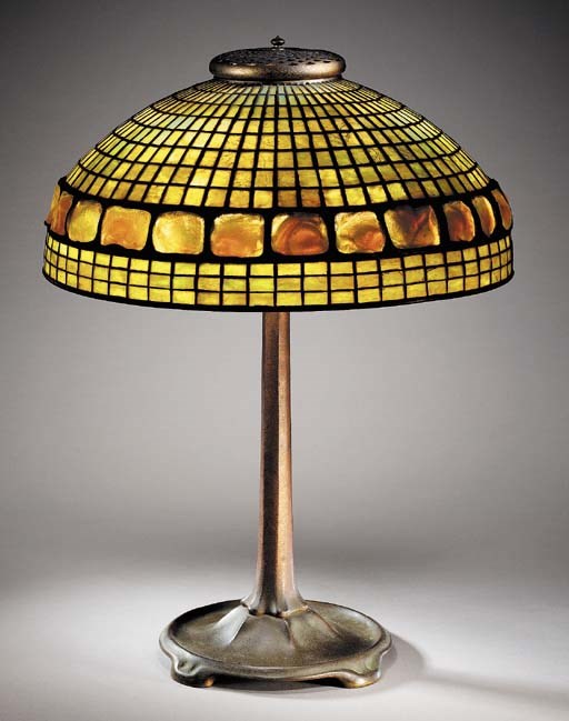 A 'BANDED TURTLEBACK TILE' LEADED GLASS AND GILT-BRONZE TABLE LAMP