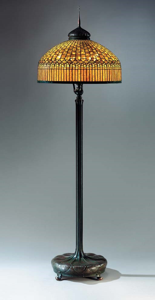 A 'CURTAIN BORDER' LEADED GLASS AND BRONZE FLOOR LAMP