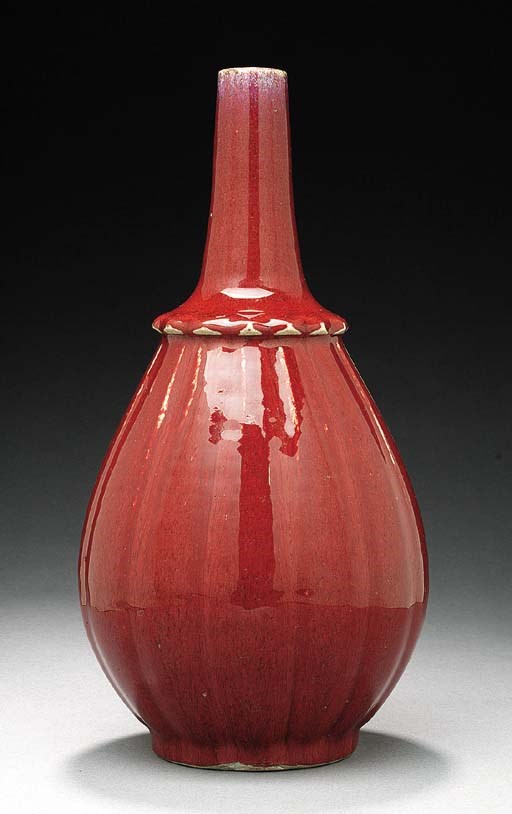 A FLAMBE GLAZED BOTTLE VASE
