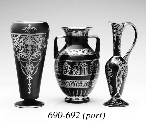 A COLLECTION OF FOUR BLACK GLASS VASES WITH SILVER OVERLAY