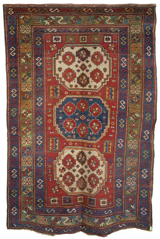 An antique triple medallion Kazak