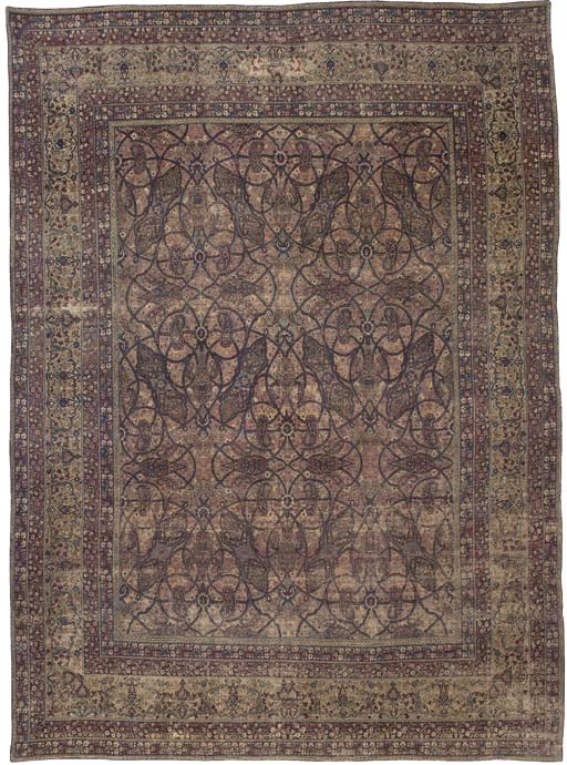 An unusual antique Kirman Laver carpet