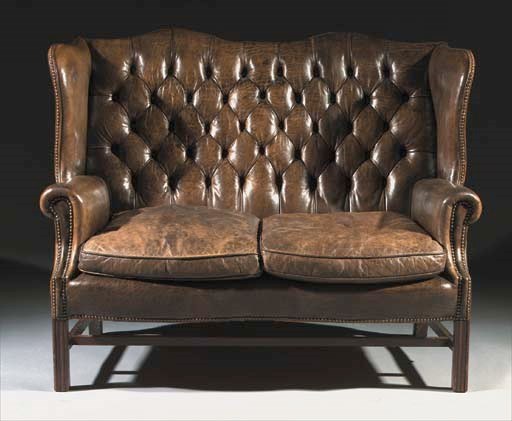 An English oak winged sofa
