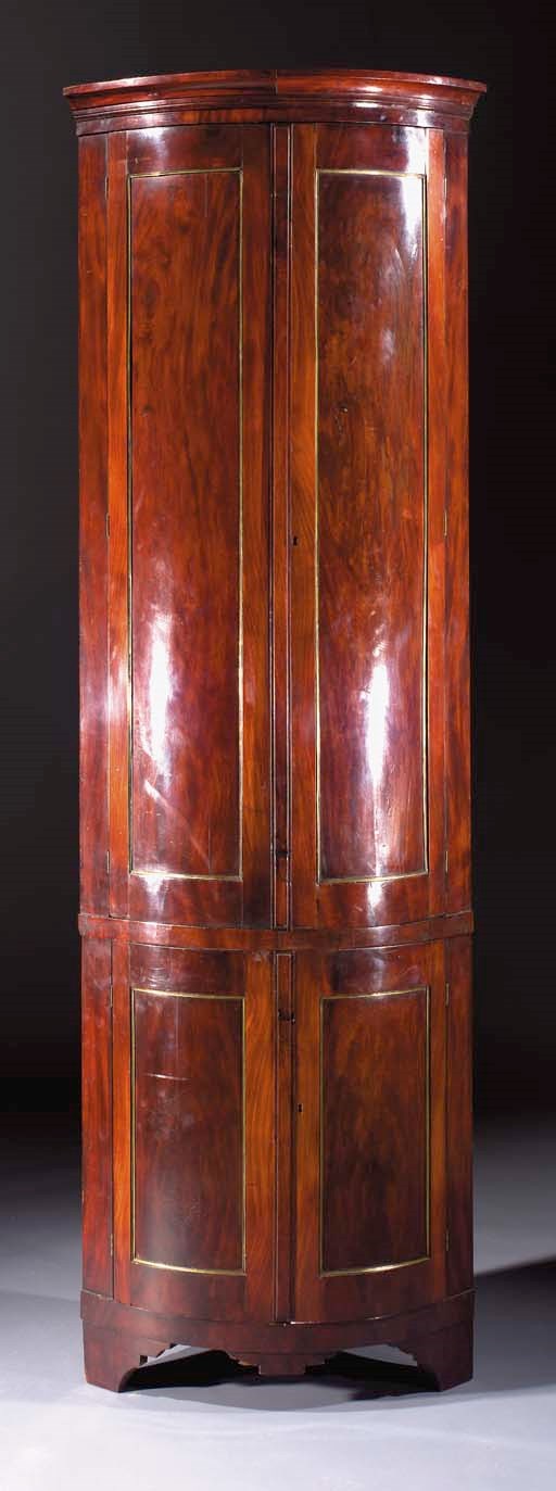A Dutch mahogany corner cabinet