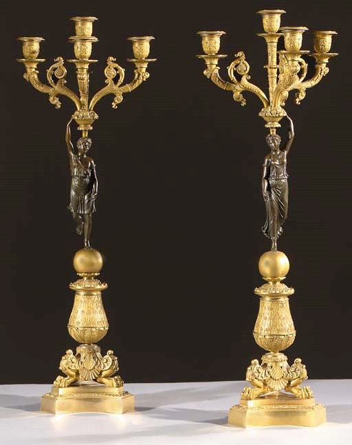 A pair of Restauration ormolu and bronze four-light candelabra
