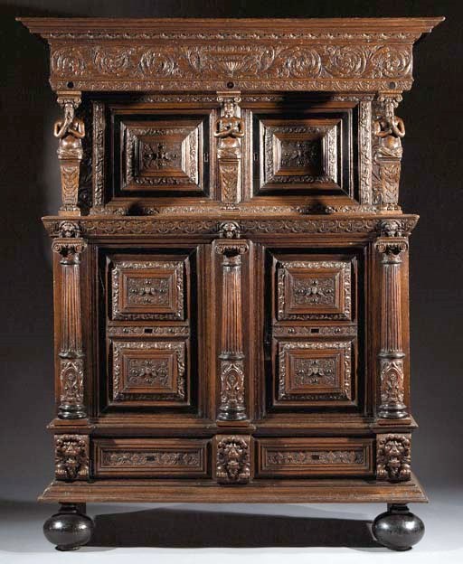A Dutch oak and ebonised cupboard