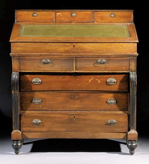 A Regency stained oak and ebonised clerck's desk
