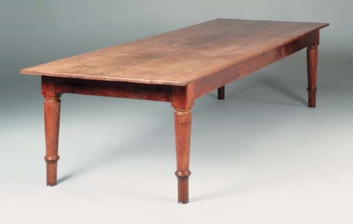 A large French oak and fruitwood farmhouse table, mid 19th century