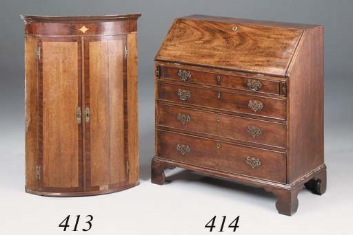 A George III oak and mahogany crossbanded North Country corner cupboard